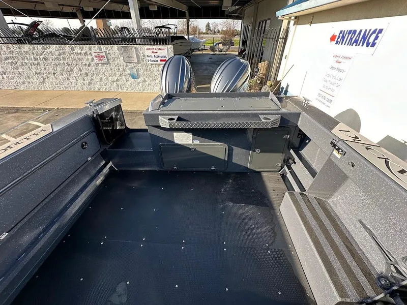 Slide: The Image of 2024 Duckworth 26 Offshore boat interior with dual engines, spacious deck, and modern design. - 15