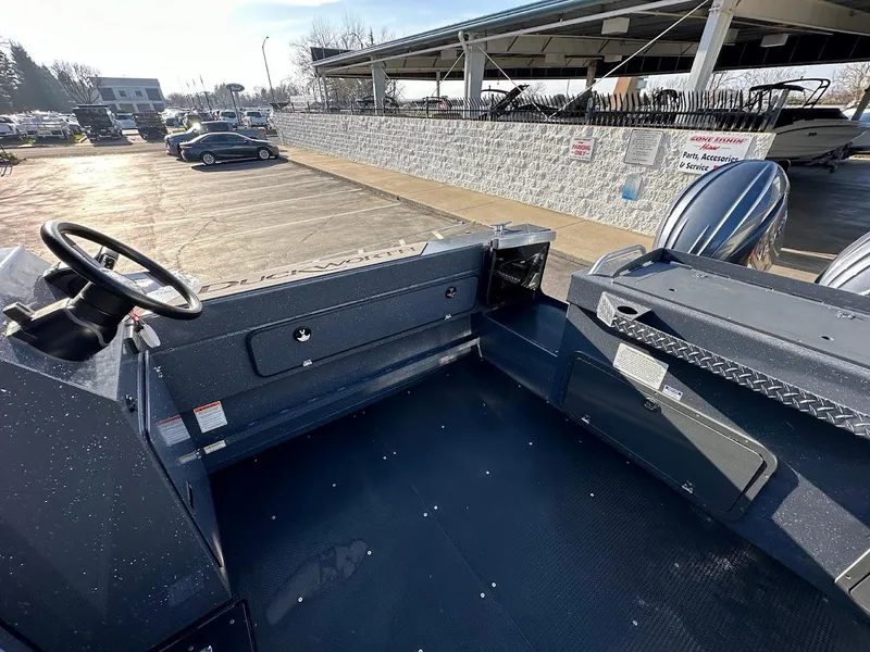 Slide: The Image of 2024 Duckworth 26 Offshore boat interior with steering wheel and spacious deck. - 16