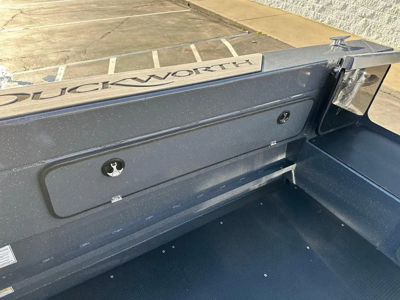 Slide: The Image of 2024 Duckworth 26 Offshore boat interior with storage compartment. - 19