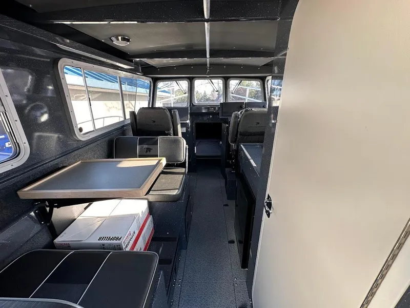 Slide: The Image of Interior of 2024 Duckworth 26 Offshore boat with seating and table. - 27