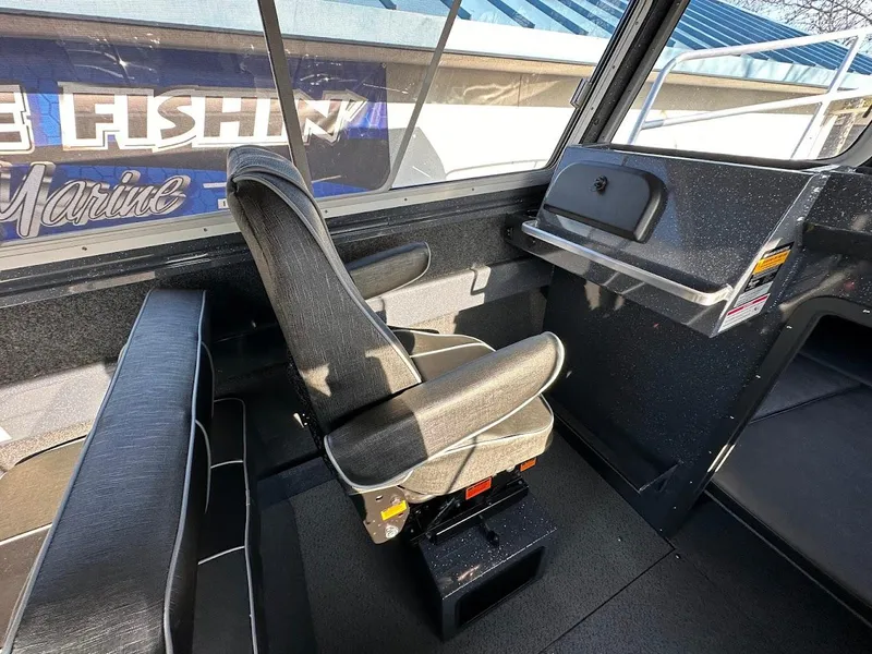Slide: The Image of Interior of 2024 Duckworth 26 Offshore boat with seating and control panel. - 30