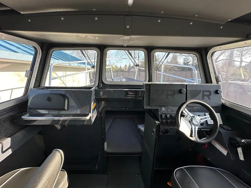 Slide: The Image of 2024 Duckworth 26 Offshore boat interior with steering wheel and dashboard. - 31