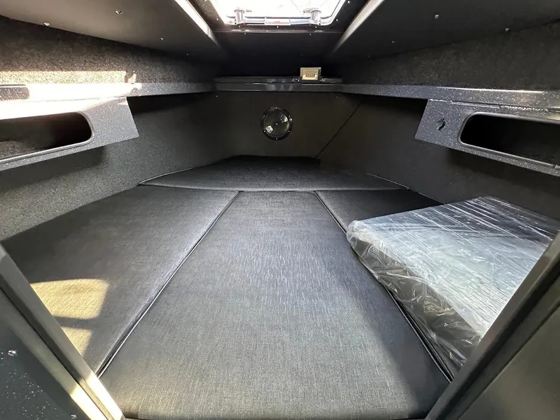 Slide: The Image of 2024 Duckworth 26 Offshore cabin interior with spacious sleeping area and storage compartments. - 42