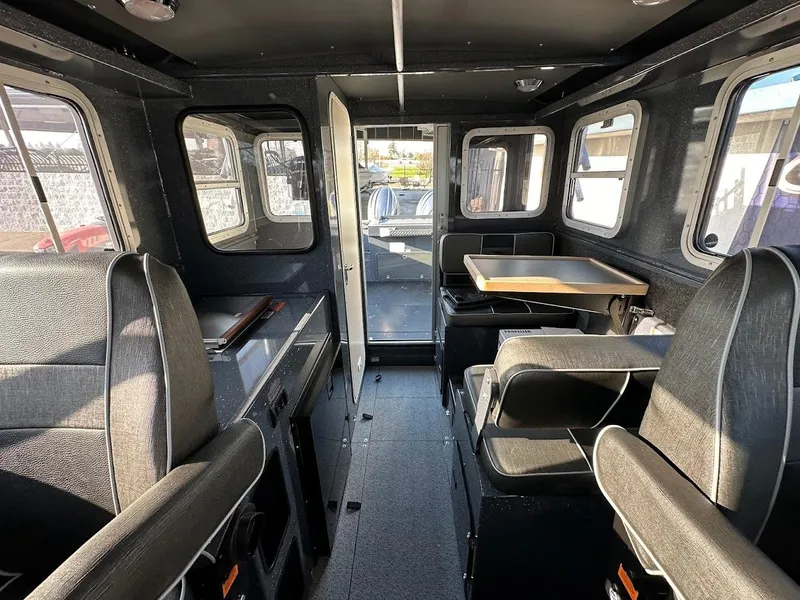 Slide: The Image of Interior of 2024 Duckworth 26 Offshore boat, featuring seating and table. - 44