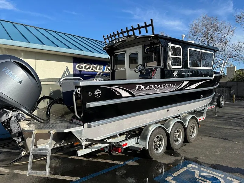 Slide: The Image of 2024 Duckworth 26 Offshore boat on trailer, parked outdoors. - 7