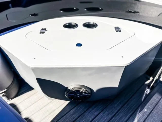 Slide: The Image of 2024 Starcraft CX 23 FD boat interior with storage compartment and speaker. - 10