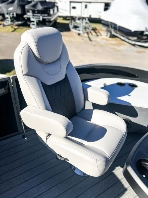 Slide: The Image of Captain's chair on 2024 Starcraft CX 23 FD pontoon boat, featuring luxurious design and comfort. - 14