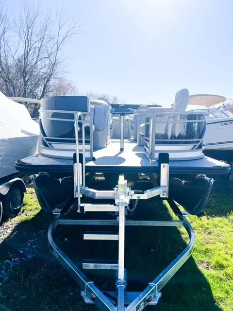 Slide: The Image of 2024 Starcraft CX 23 FD pontoon boat on trailer, front view. - 17