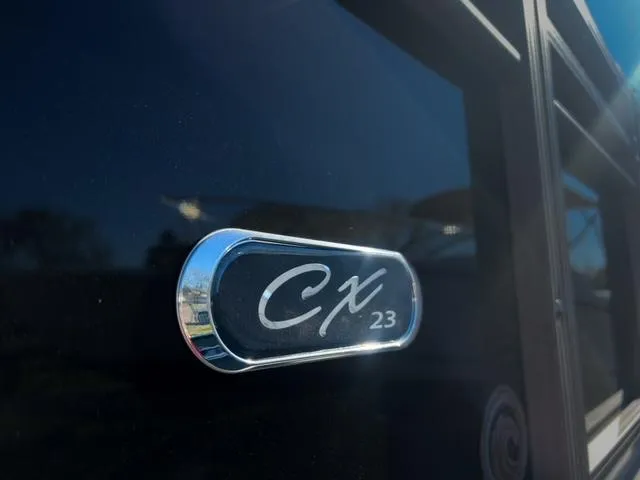 Slide: The Image of Close-up of 2024 Starcraft CX 23 FD model badge on black exterior. - 19