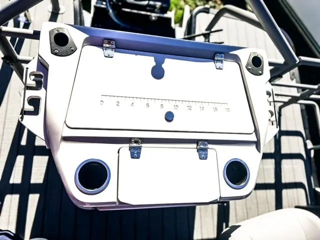 Slide: The Image of 2024 Starcraft CX 23 FD boat console with cup holders and measurement scale. - 7