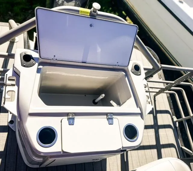 Slide: The Image of Open storage compartment on a 2024 Starcraft CX 23 FD boat. - 8