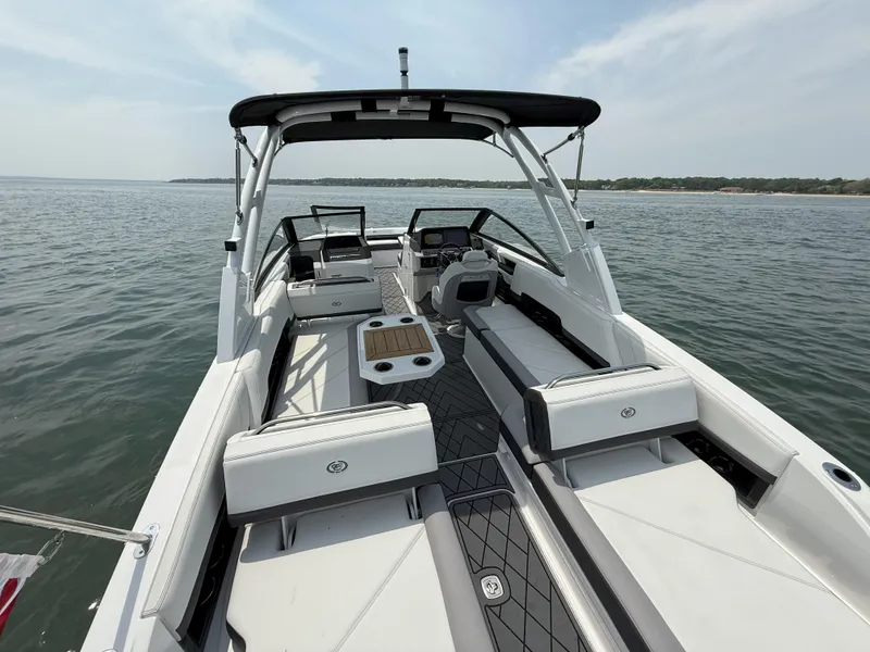 Slide: The Image of 2024 Cobalt R8 Outboard boat interior with sleek seating and modern design on open water. - 14