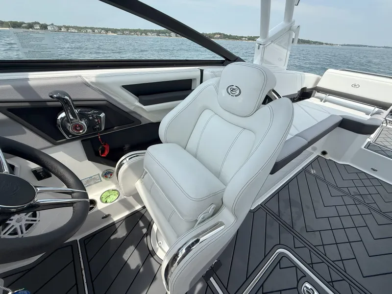 Slide: The Image of 2024 Cobalt R8 Outboard boat interior with luxurious white seating and modern controls. - 18