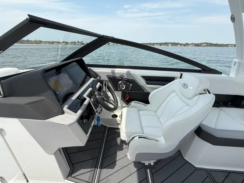Slide: The Image of 2024 Cobalt R8 Outboard boat interior with sleek dashboard and comfortable seating. - 19