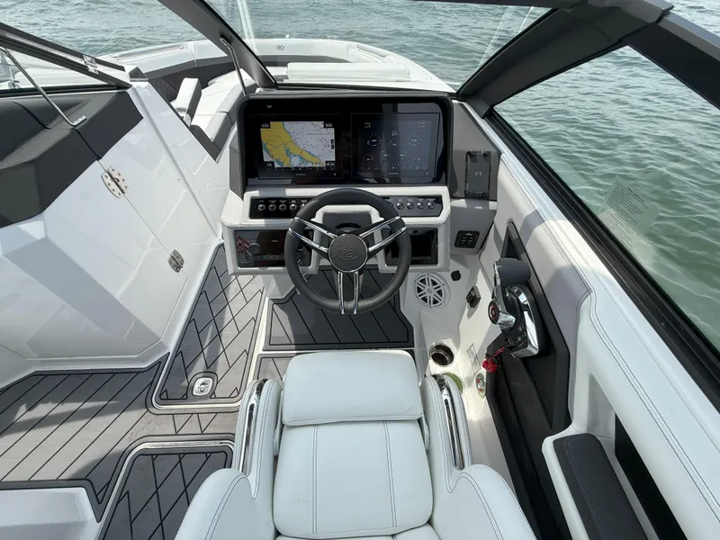 Slide: The Image of 2024 Cobalt R8 Outboard boat cockpit with modern steering and navigation system. - 20