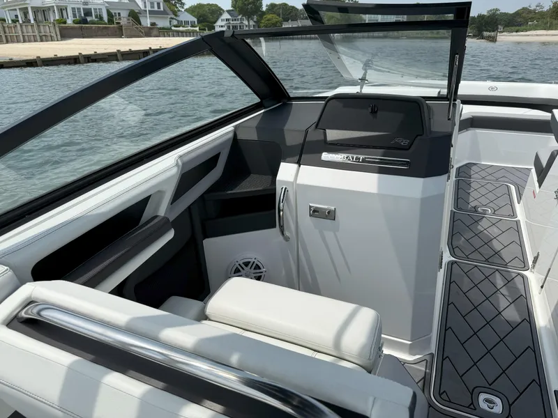 Slide: The Image of 2024 Cobalt R8 Outboard boat interior with sleek design and waterfront view. - 23