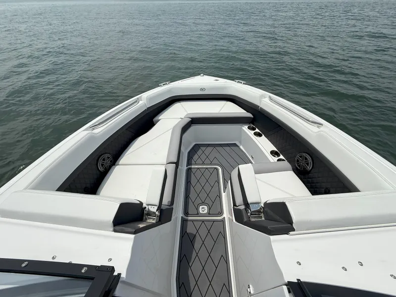 Slide: The Image of 2024 Cobalt R8 Outboard boat interior with sleek seating and modern design on open water. - 27