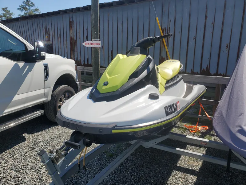 Slide: The Image of 2019 Yamaha WaveRunner EX Deluxe jet ski on a trailer in a parking lot. - 0