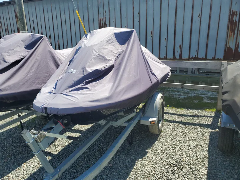 Slide: The Image of 2019 Yamaha WaveRunner EX Deluxe covered on a trailer in a storage area. - 4