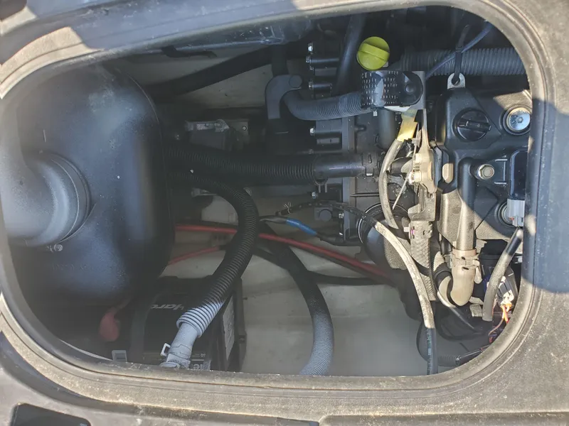 Slide: The Image of 2019 Yamaha WaveRunner EX Deluxe engine compartment with visible wiring and components. - 6