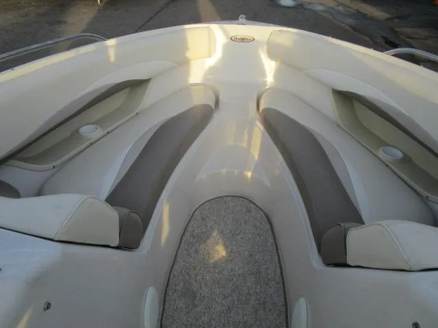 Slide: The Image of 1998 Four Winns 240 Horizon boat interior with cushioned seating. - 5