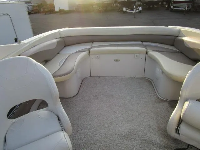 Slide: The Image of 1998 Four Winns 240 Horizon boat interior with spacious seating area. - 7