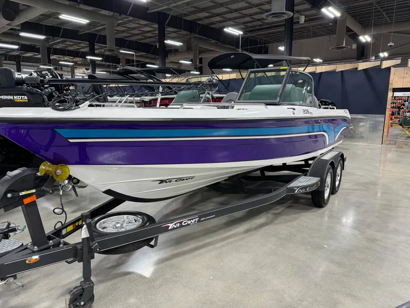 Slide: The Image of 2023 Yar-Craft 209 TFX boat on display in a showroom. - 1