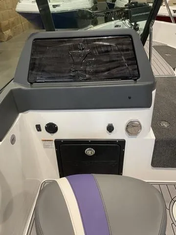 Slide: The Image of 2023 Yar-Craft 209 TFX boat dashboard and seating area. - 10