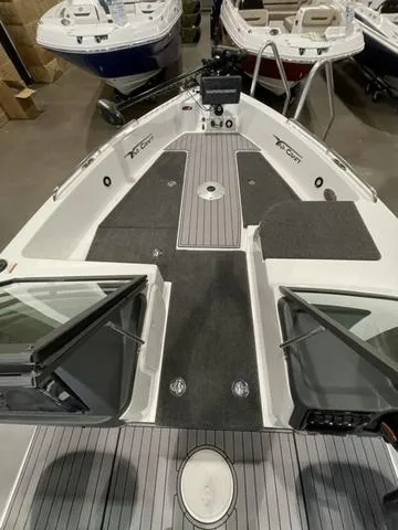 Slide: The Image of 2023 Yar-Craft 209 TFX boat interior with advanced navigation system and spacious deck. - 11