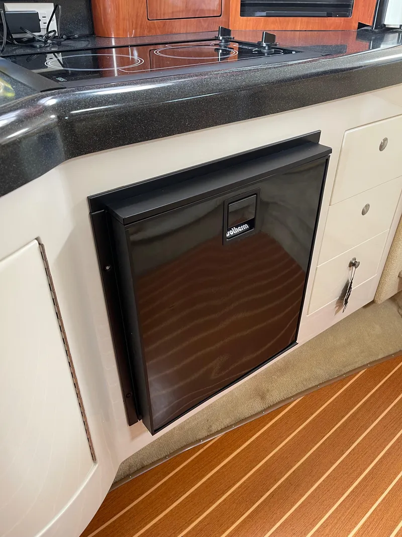 Slide: The Image of Compact refrigerator in the galley of a 2006 Monterey 322 Cruiser boat. - 10