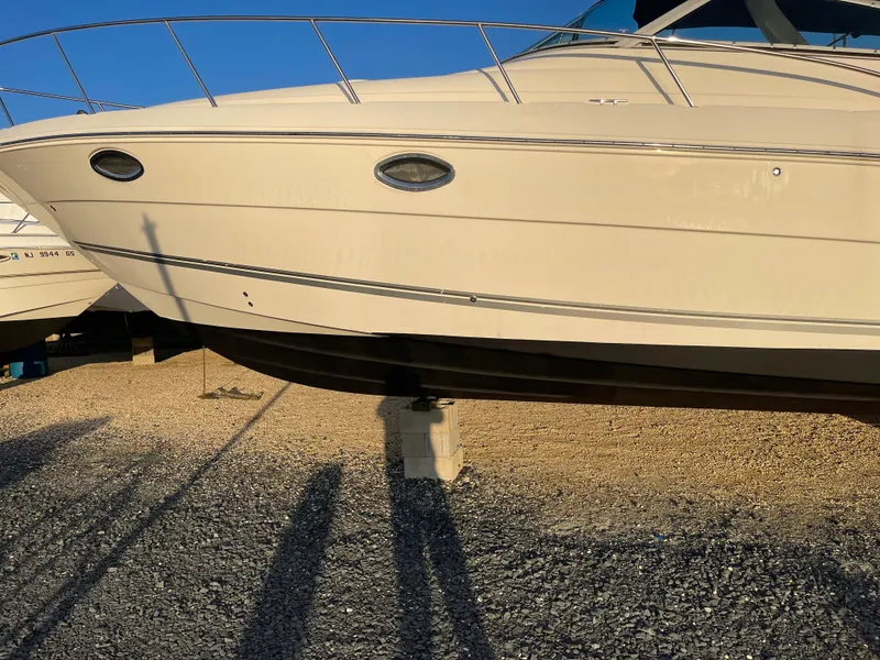 Slide: The Image of 2006 Monterey 322 Cruiser boat on dry dock, side view. - 2