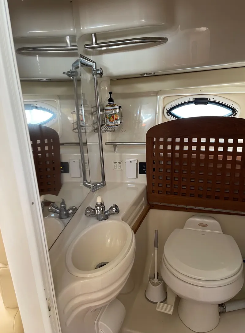 Slide: The Image of 2006 Monterey 322 Cruiser bathroom with sink, toilet, and mirror. - 22