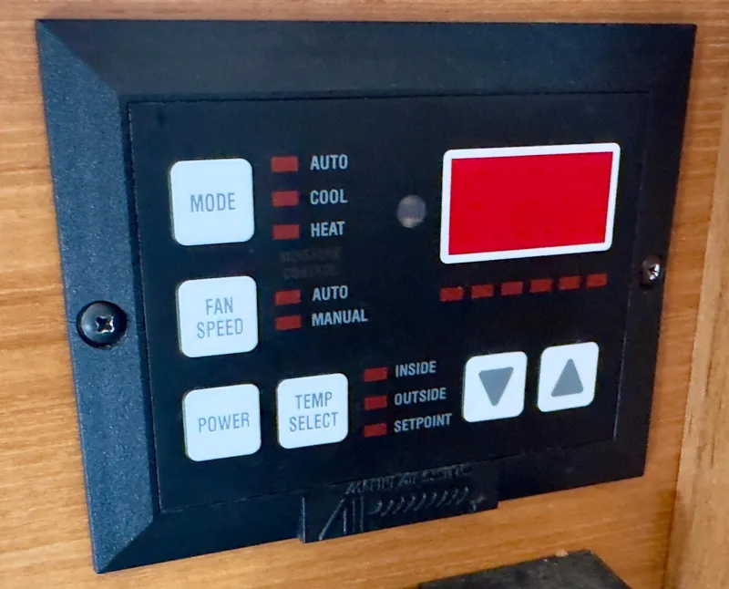 Slide: The Image of Control panel of a 1998 Bayliner 3388 Command Bridge Motoryacht, featuring mode and temperature settings. - 15