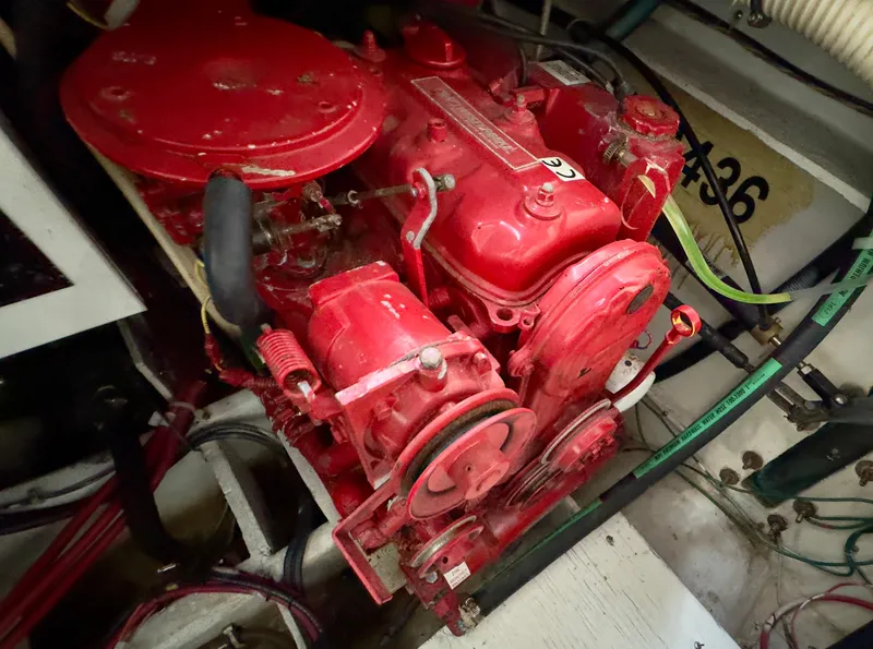 Slide: The Image of Engine of 1998 Bayliner 3388 Command Bridge Motoryacht, vibrant red, detailed view. - 17