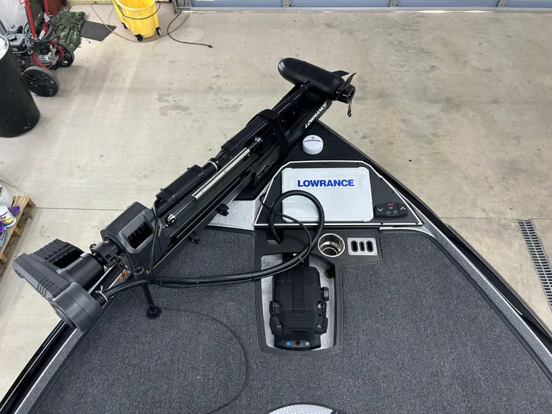 Slide: The Image of 2024 Ranger Z520R Ranger Cup Equipped boat with Lowrance electronics in a garage. - 10