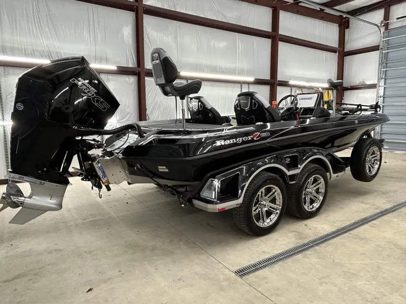 Slide: The Image of 2024 Ranger Z520R Ranger Cup Equipped boat in a garage, featuring a powerful Mercury Pro XS engine. - 16
