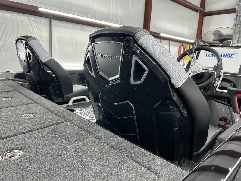 Slide: The Image of 2024 Ranger Z520R Ranger Cup Equipped boat interior with black seats and steering wheel. - 20