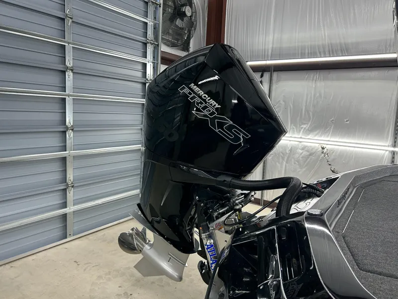 Slide: The Image of 2024 Ranger Z520R Ranger Cup Equipped with Mercury Pro XS engine in a garage. - 3