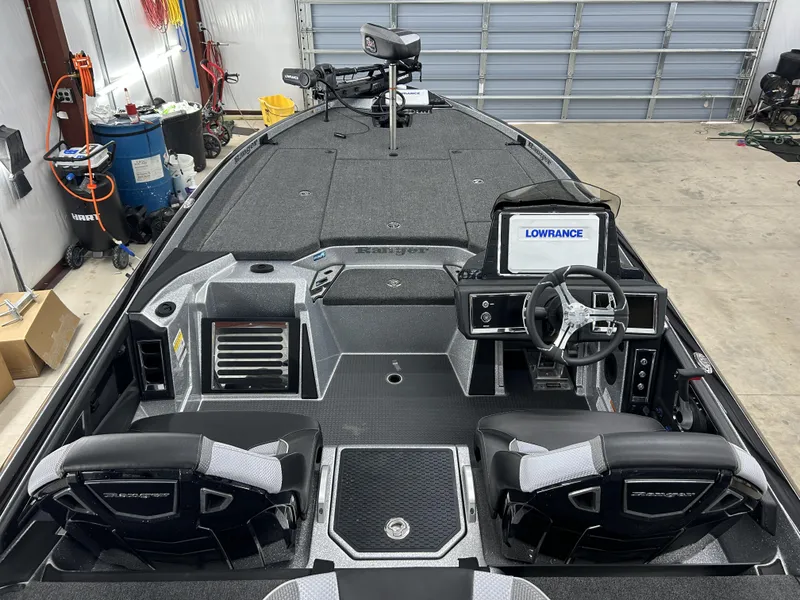 Slide: The Image of 2024 Ranger Z520R Ranger Cup Equipped boat interior with Lowrance electronics in a garage. - 6