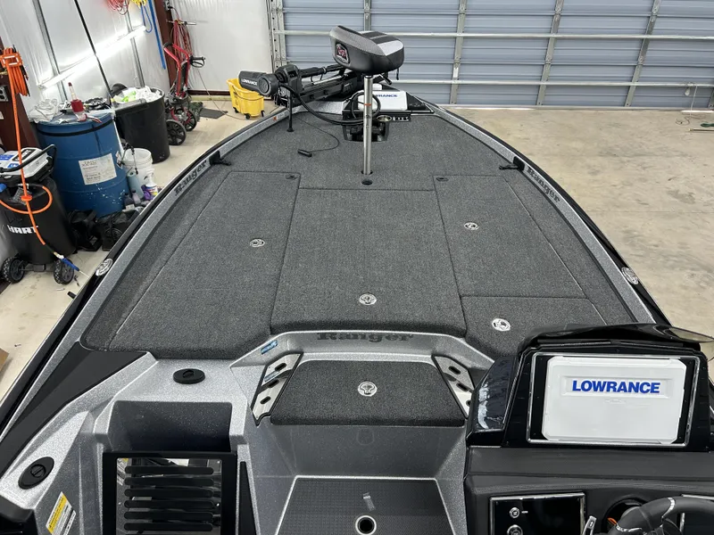 Slide: The Image of 2024 Ranger Z520R Ranger Cup Equipped boat with Lowrance electronics in a garage. - 8