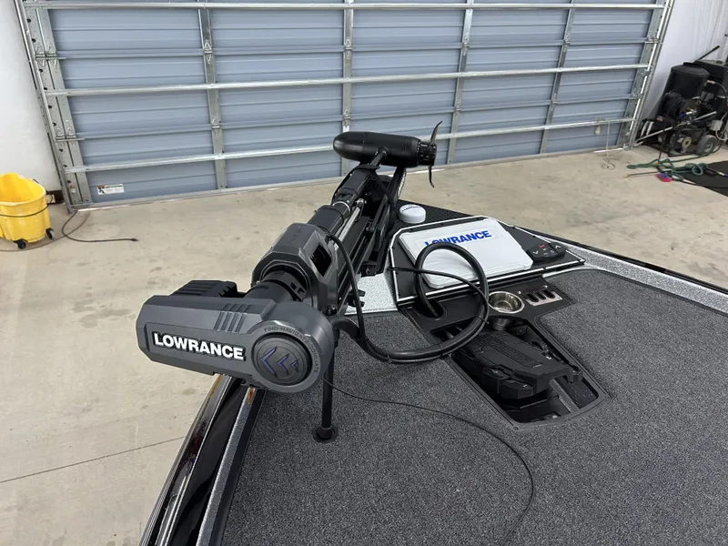 Slide: The Image of 2024 Ranger Z520R Ranger Cup Equipped with Lowrance electronics in a garage. - 9