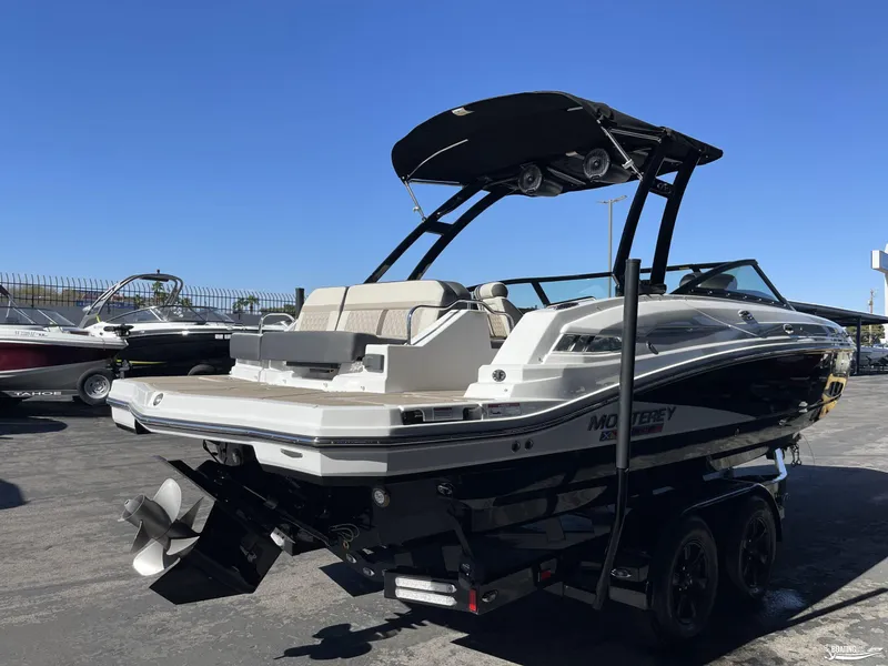 Slide: The Image of 2024 Monterey M4 boat with black and white exterior on a trailer. - 3