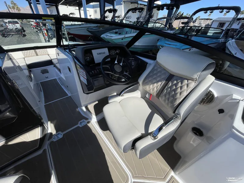 Slide: The Image of 2024 Monterey M4 boat interior with captain's chair and dashboard. - 5