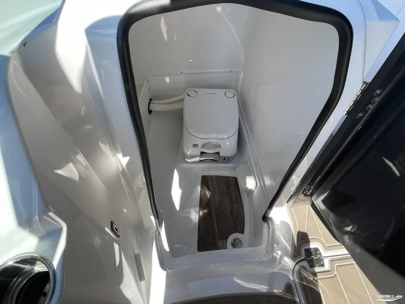 Slide: The Image of 2024 Monterey M4 boat interior with compact toilet and wooden flooring. - 9
