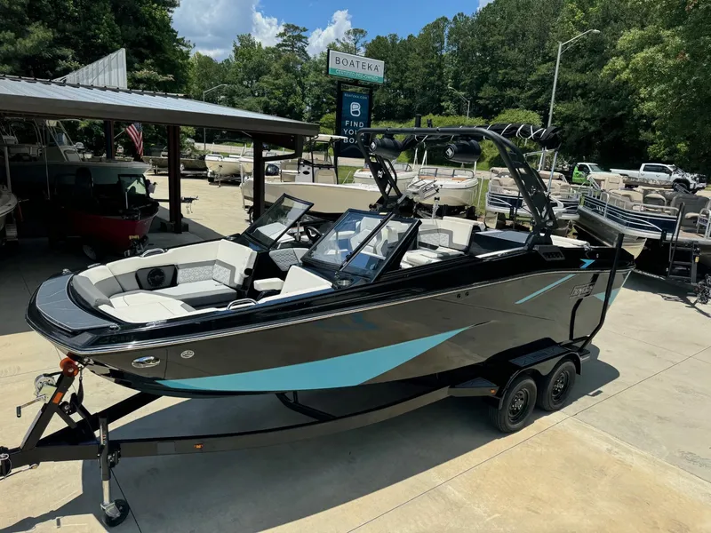 The Image of 2023 Heyday H-22 boat on trailer at dealership, ready for sale. - 0
