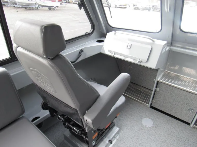 Slide: The Image of Interior of 2024 Hewescraft 220 Ocean Pro HT FC boat with gray seating and storage. - 13