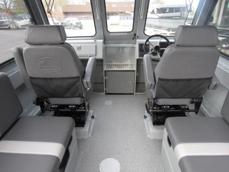 Slide: The Image of Interior of 2024 Hewescraft 220 OCEAN PRO HT FC boat with grey seating and steering console. - 17