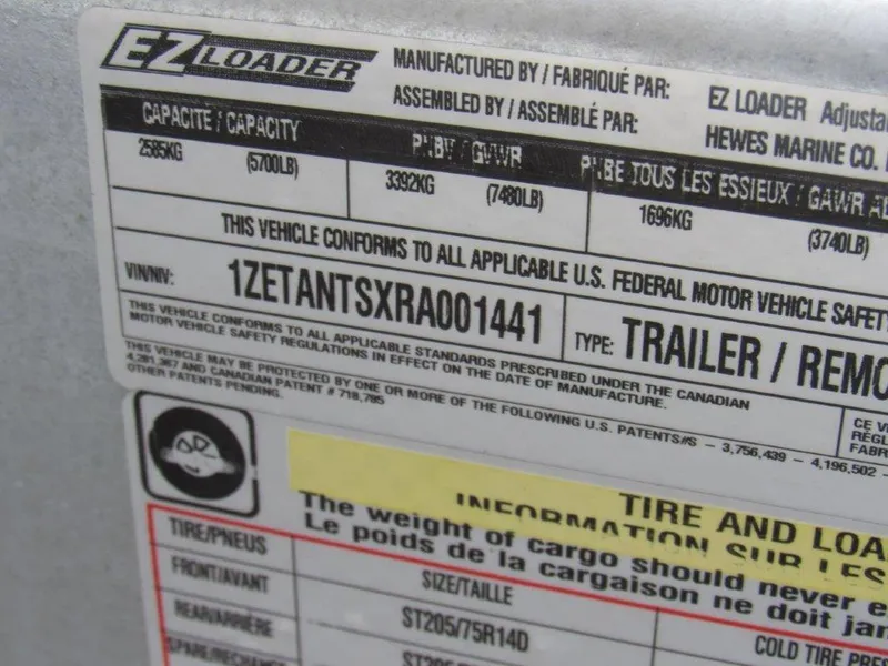 Slide: The Image of 2024 Hewescraft 220 OCEAN PRO HT FC trailer label with VIN and capacity details. - 19