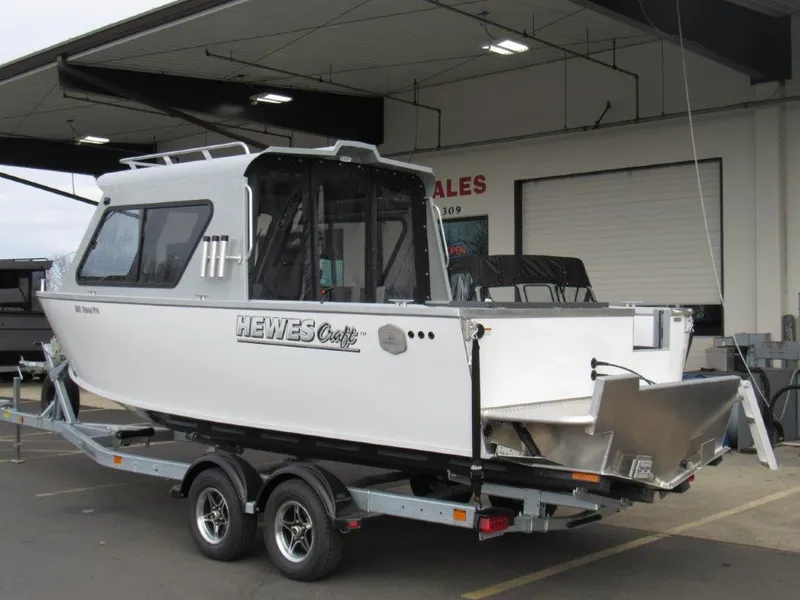 Slide: The Image of 2024 Hewescraft 220 Ocean Pro HT FC boat on a trailer at a dealership. - 3