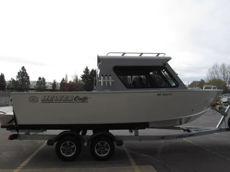 Slide: The Image of 2024 Hewescraft 220 Ocean Pro HT FC boat on trailer. - 6